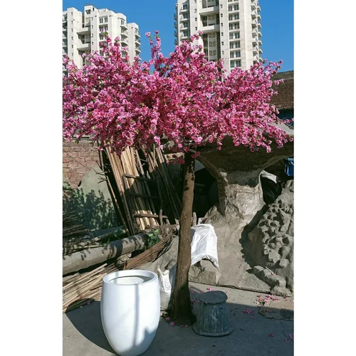 One sided artificial pink blossom tree